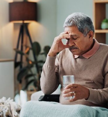Elderly man in wheelchair looking tired