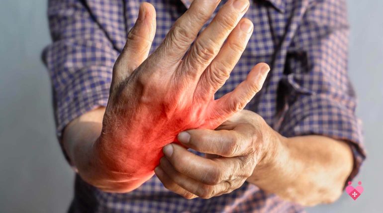 Senior massaging their hand to relieve arthritis joint pain and stiffness.